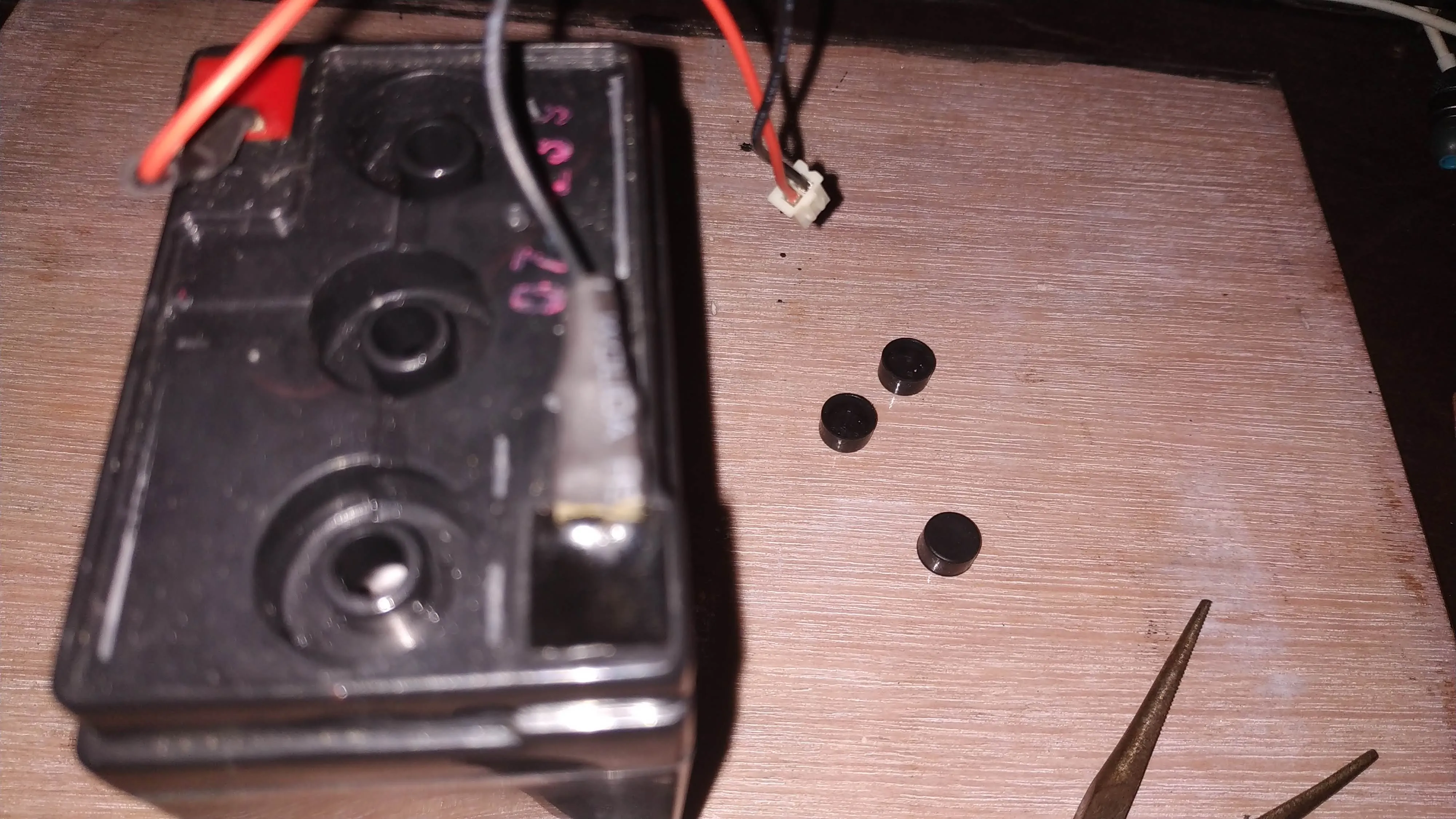  Removed the battery covers with a needle-nose plier