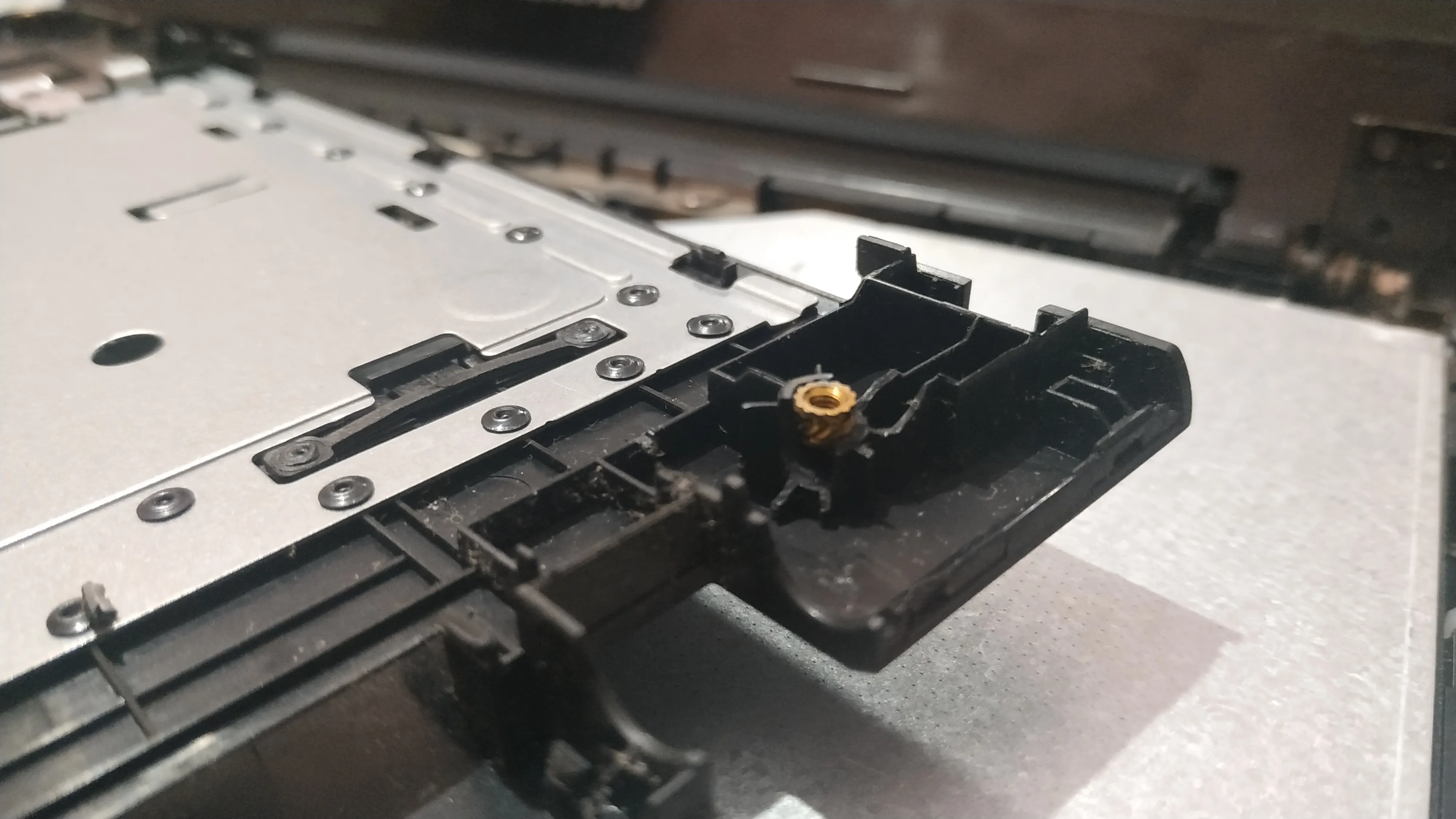  I just had a small hunch and simply removed the left hinge. Was shocked to find this!