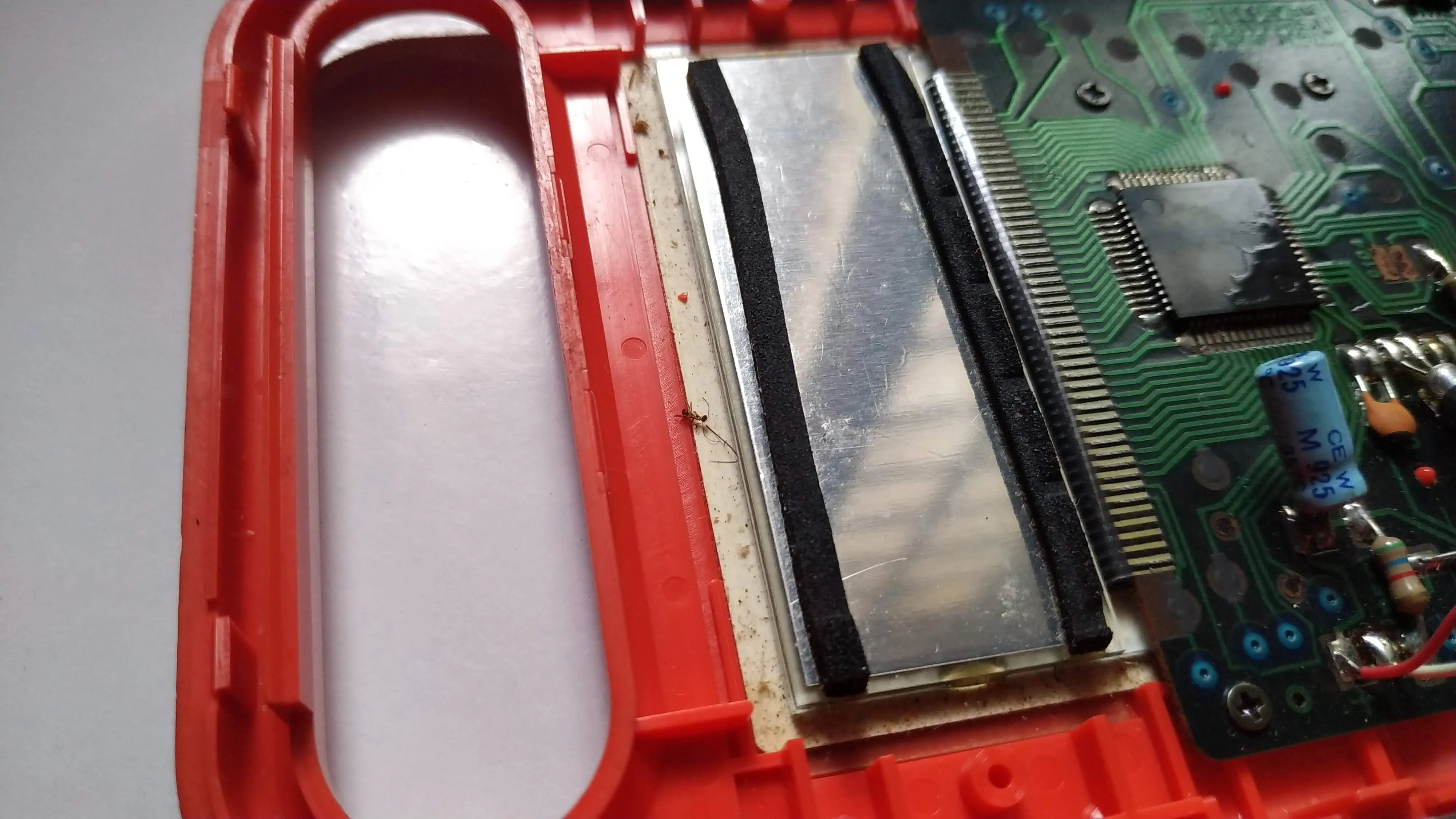  If you look carefully you can see a dead ant inside (near the display filters). And how did it get there - I don